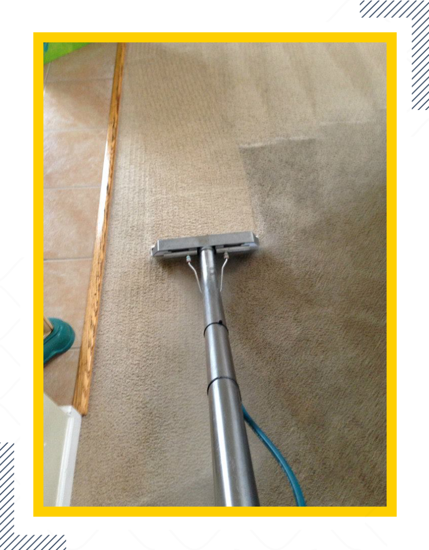 A carpet cleaning machine is being used to clean the floor.