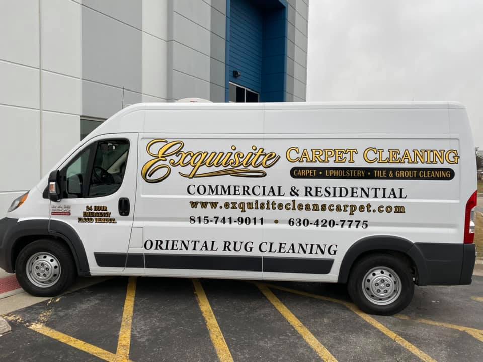 A white carpet cleaning van parked in the parking lot.