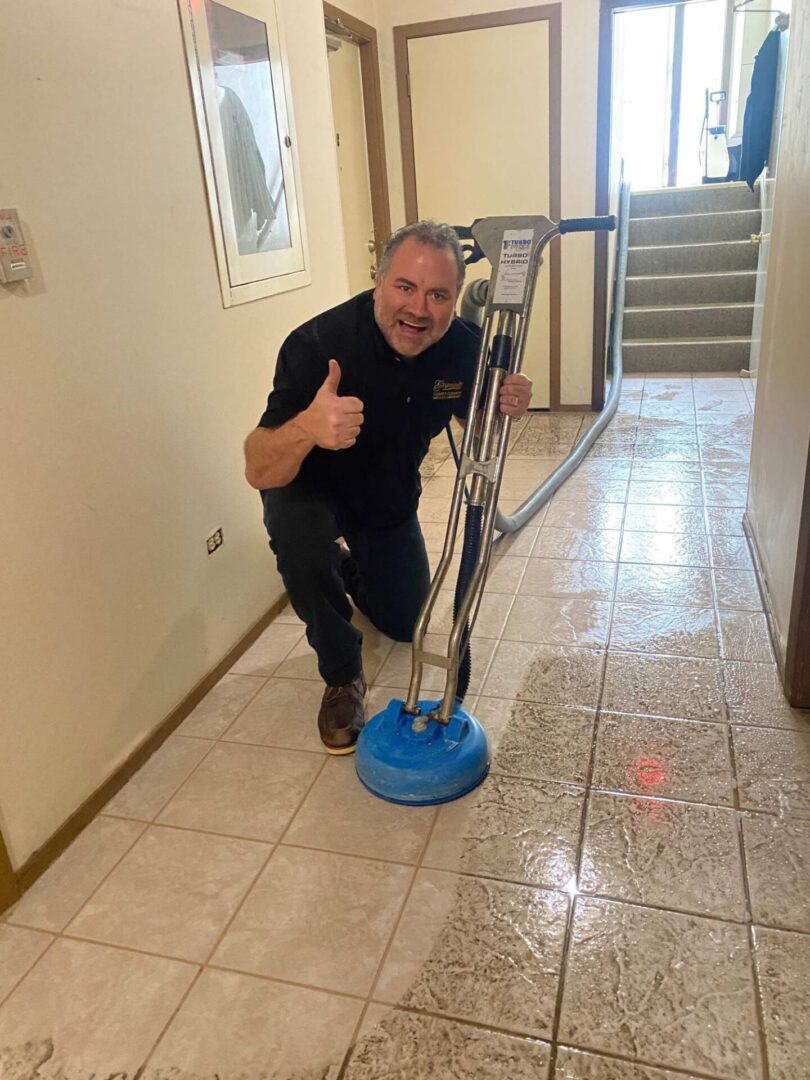 A man is standing in front of a tile floor