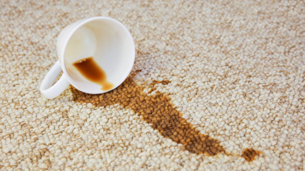 A spilled coffee cup leaving a stain on carpet.